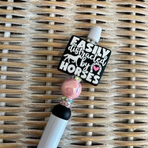 Easily distracted by horses pen